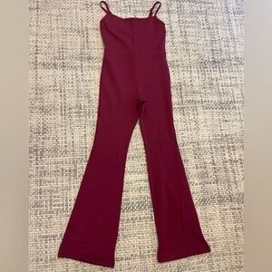 Aritzia workout one piece jump suite flare leg, Sz.s, in burgundy. Worn once.